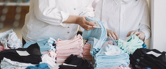 inspector examining kids garments under a lighting box