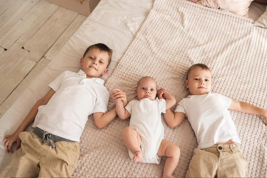 Organic cotton and bamboo fiber baby rompers side by side comparison