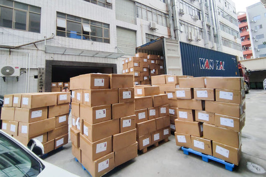 Small batch baby clothing orders packed with different private label tags at Muhong Apparel factory