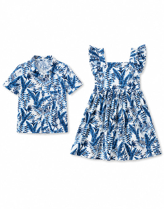 Sibling matching tropical blue palm leaf set boy shirt and girl dress flat lay - Alice Apparel