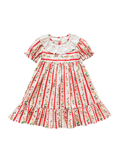Front view of a girls bunny carrot print cotton dress with short sleeves and petal collar