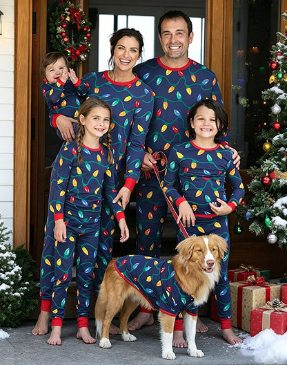 Family and dog in matching holiday pajamas at Christmas doorway - Alice Apparel