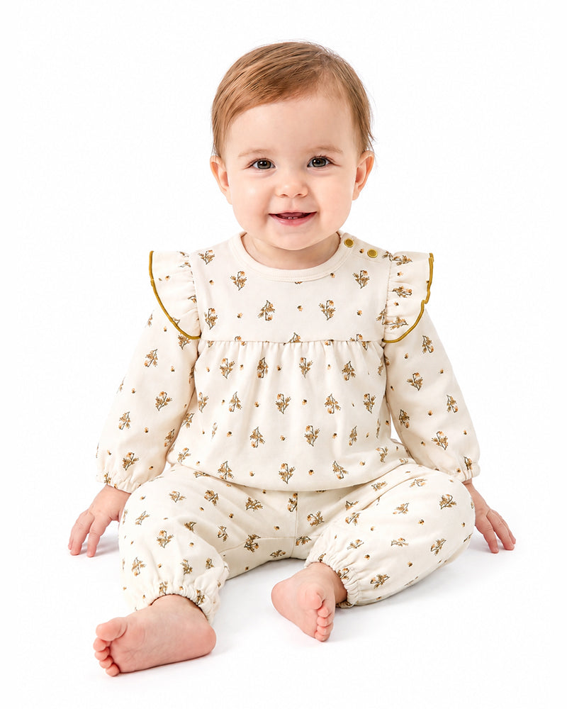 Baby wearing matching bamboo ruffle print pajama set