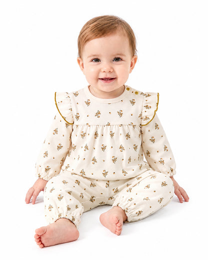 Baby wearing matching bamboo ruffle print pajama set