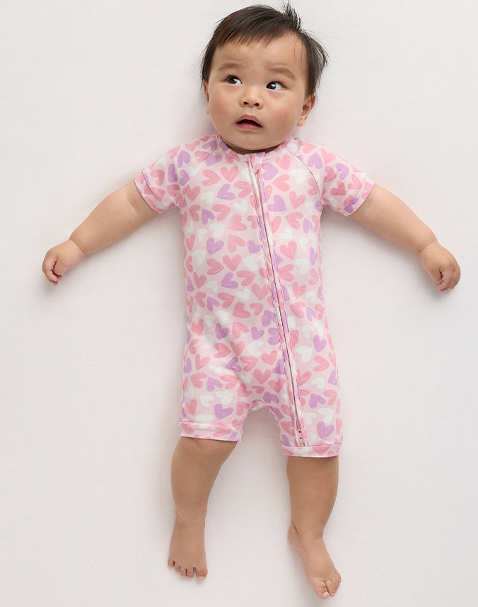 Baby wearing bamboo viscose heart print shortie zip romper - Alice Apparel