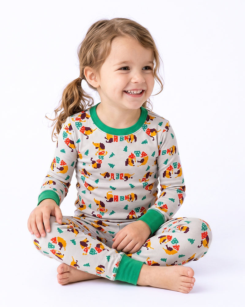 Girl wearing matching cartoon print long sleeve kids pajamas