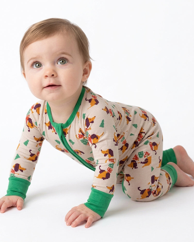 Baby crawling in cartoon print zip-front pajama romper