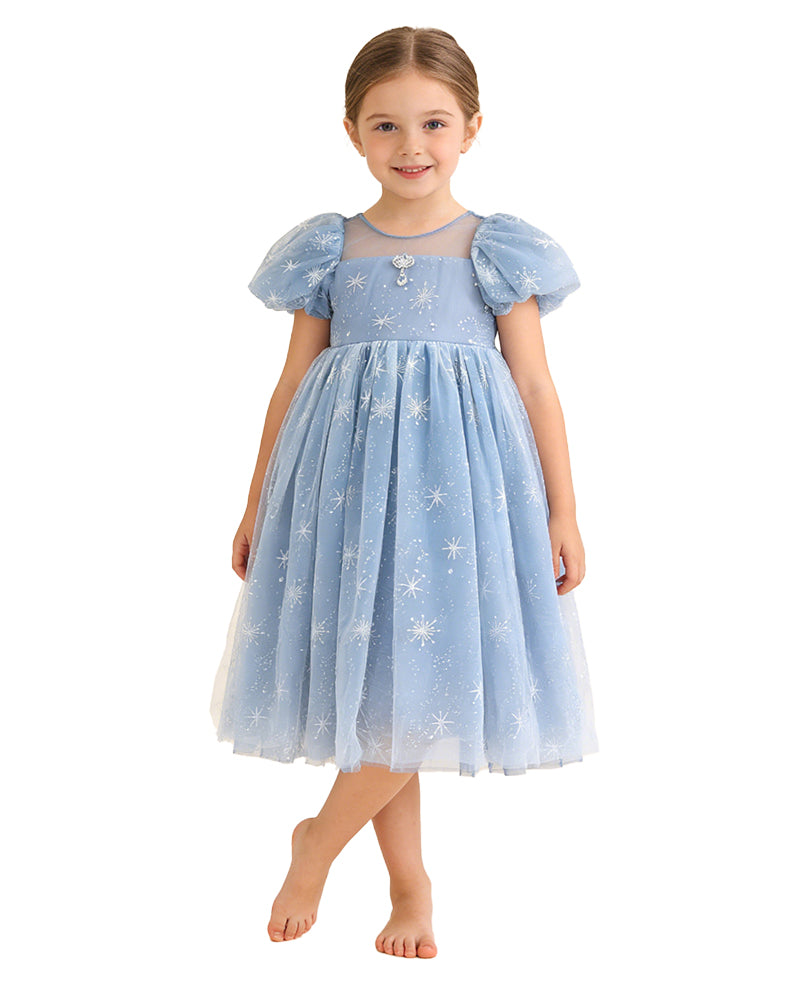Girl wearing a blue snowflake tulle party dress with short puff sleeves