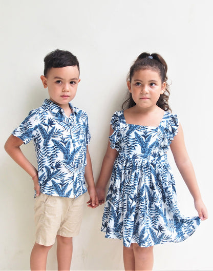 Brother and sister wearing matching blue palm leaf tropical shirt and dress - Alice