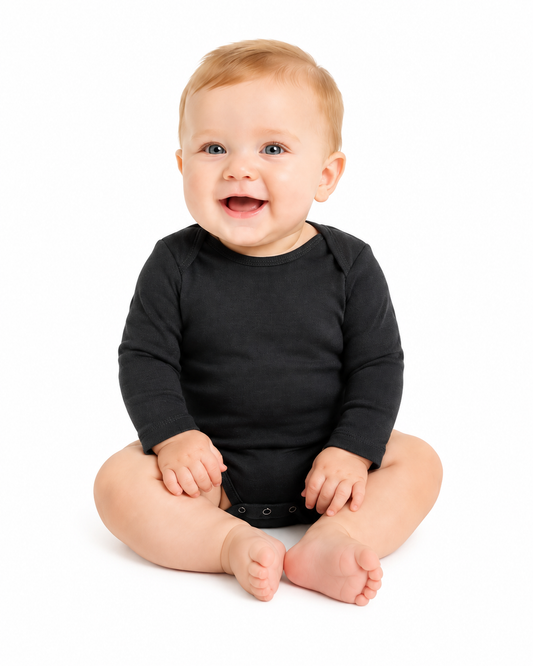 Babies wearing coordinated earth-tone long-sleeve bodysuits in five solid colors