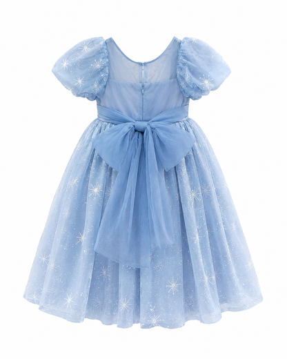 Back view of a girls blue snowflake tulle dress with a waist bow