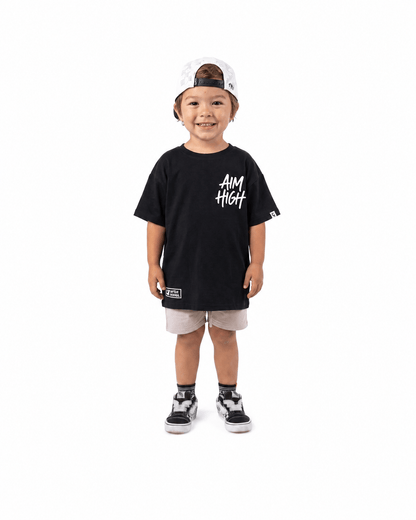 Boy wearing black Aim High graphic T-shirt
