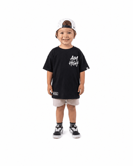 Boy wearing black Aim High graphic T-shirt