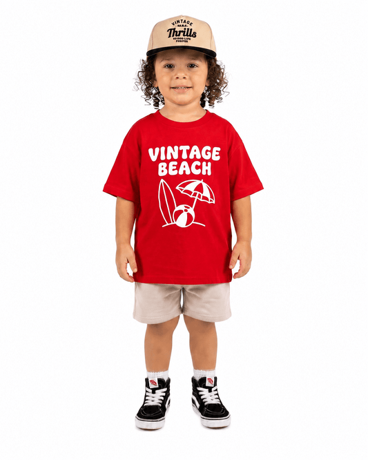 Boy wearing red Vintage Beach graphic T-shirt