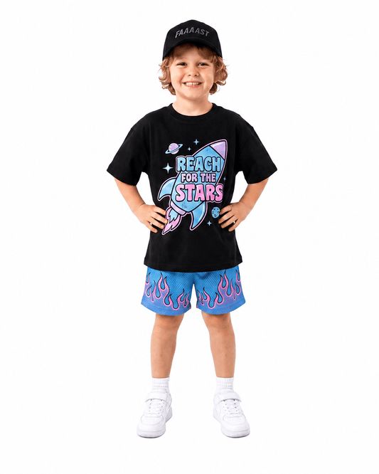 Boy wearing black rocket and stars graphic short sleeve T-shirt