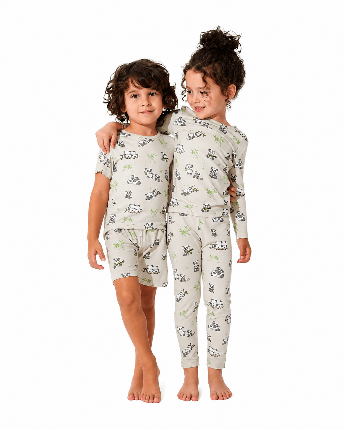 Children wearing matching printed short and long pajama sets