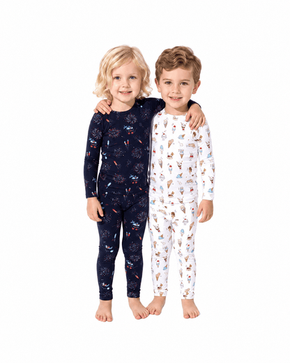 Children wearing navy and white printed sibling matching pajama sets