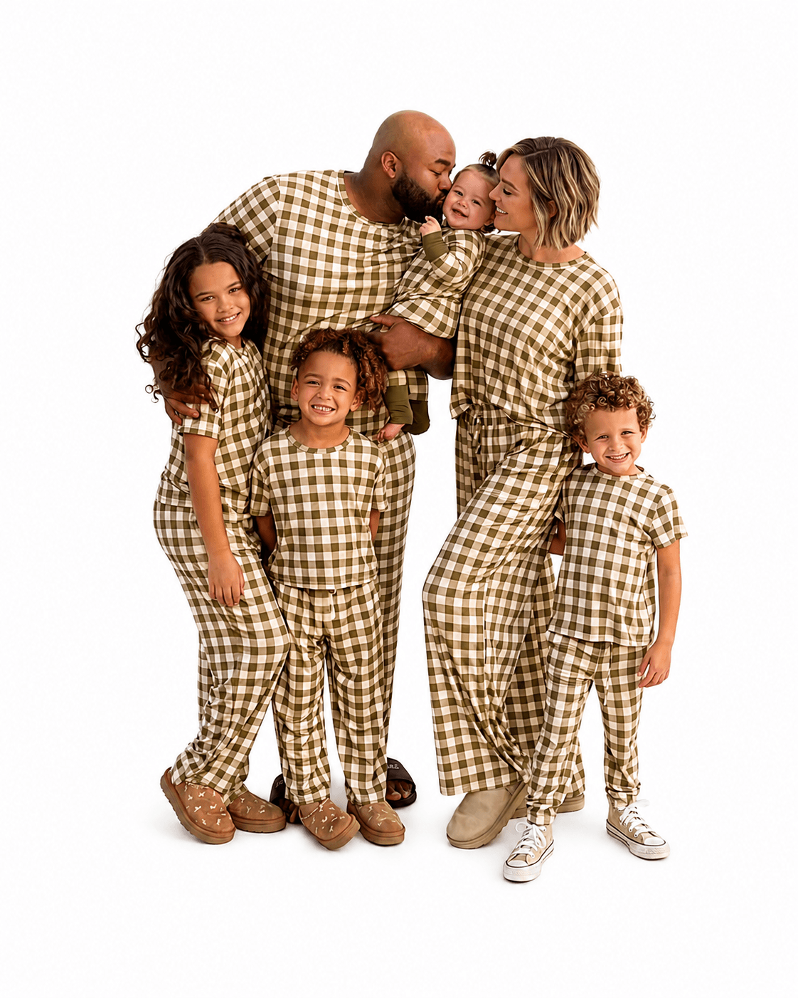 Family wearing brown gingham matching pajamas in adult kids and baby styles