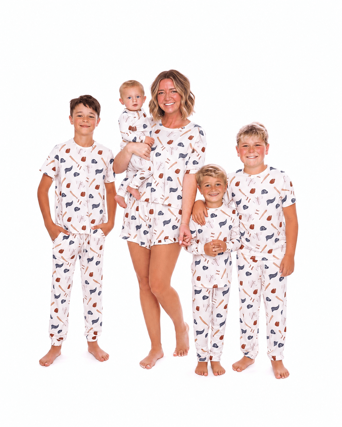 Family wearing white printed matching pajamas in adult kids and baby styles