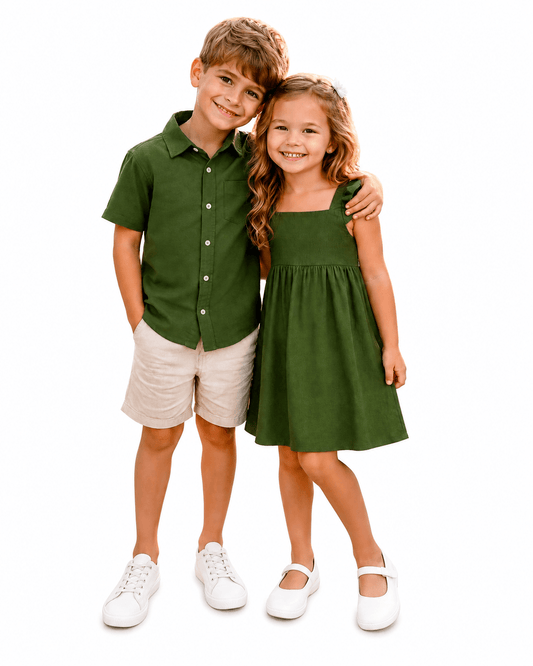 Boy and girl wearing olive green sibling matching outfits with shirt, shorts, and dress