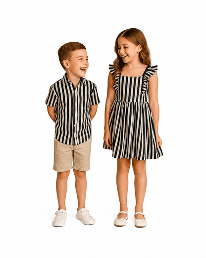 Boy and girl wearing black and white striped sibling matching outfits