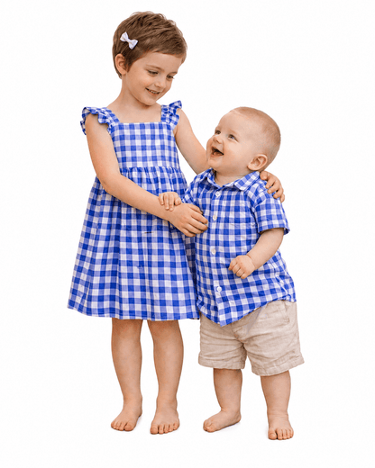 Girl and toddler boy wearing blue gingham brother and sister matching outfits
