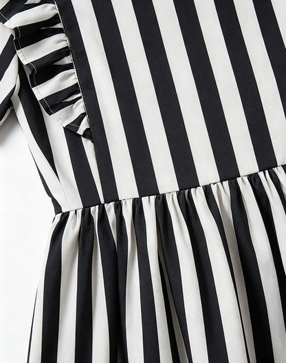 Close-up of ruffle detail on black and white striped sibling matching dress - Alice Apparel