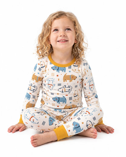 Girl wearing matching animal print two-piece kids pajamas