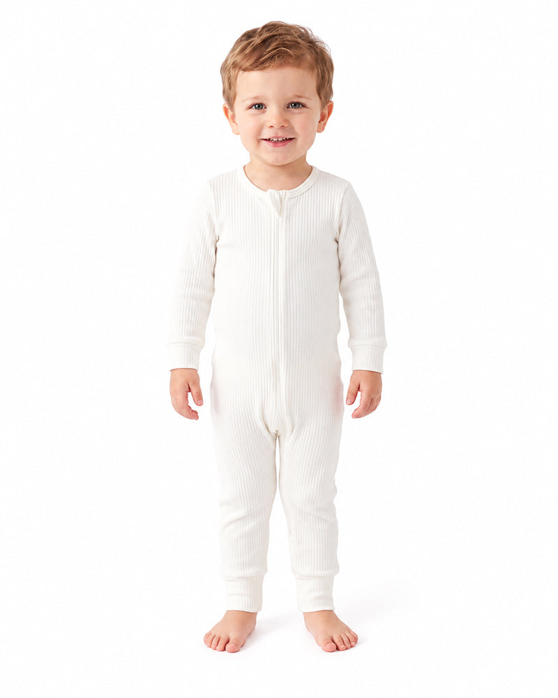 Toddler wearing ivory bamboo long sleeve footless romper