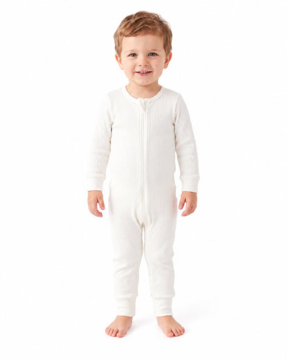 Toddler wearing ivory bamboo long sleeve footless romper