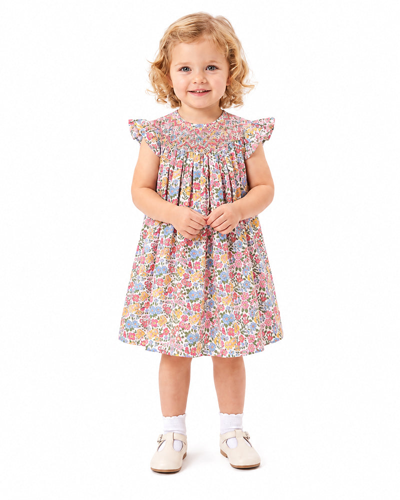 Girl wearing multicolor floral ruffle sleeve dress