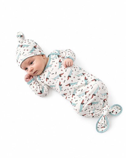 Newborn baby wearing printed footed pajamas manufacturer