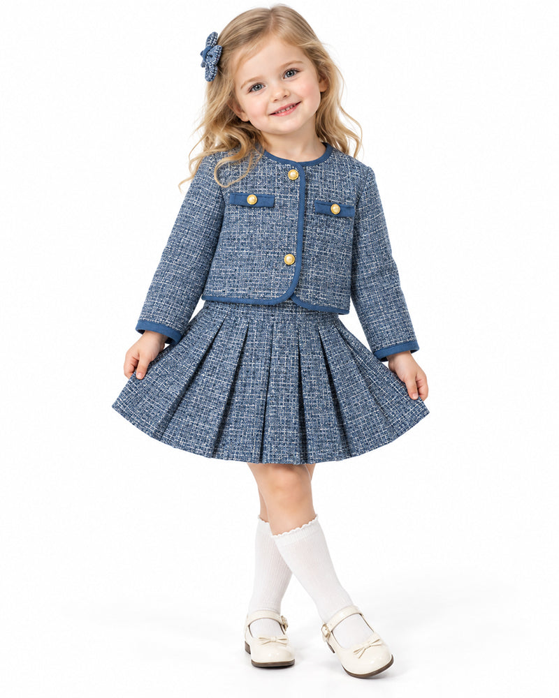 Girl wearing navy tweed jacket and pleated skirt set