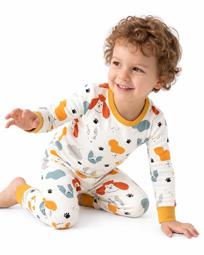 Child wearing matching animal print two-piece pajamas