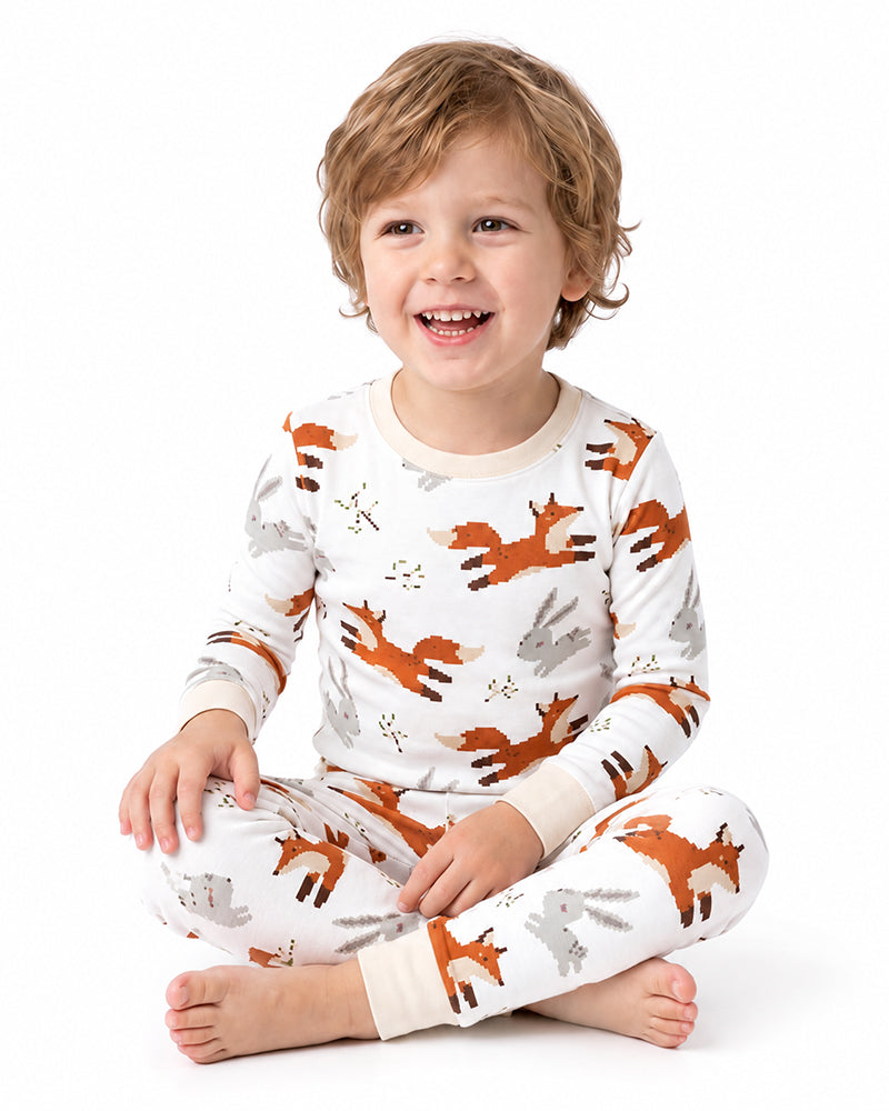 Child wearing custom fox print long sleeve pajama set