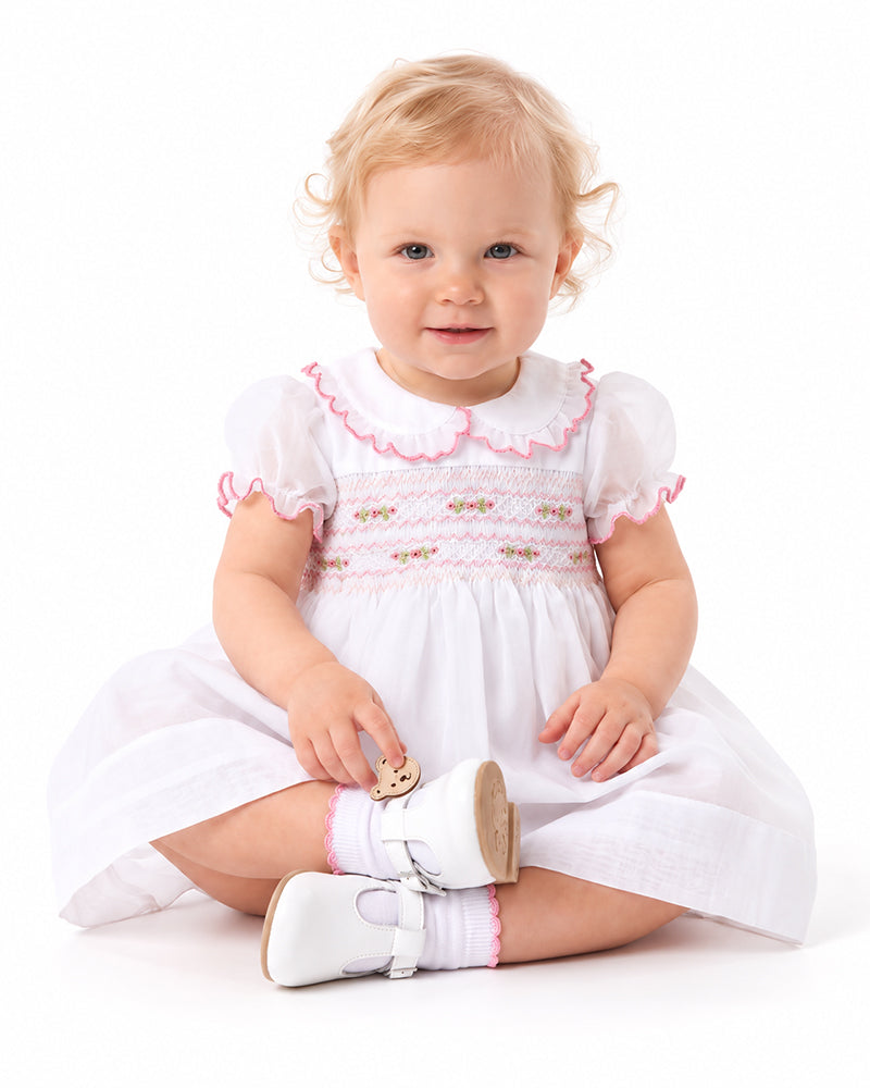Girls white occasion dress with pink trim and gathered skirt