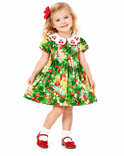 Girl wearing green floral Peter Pan collar dress
