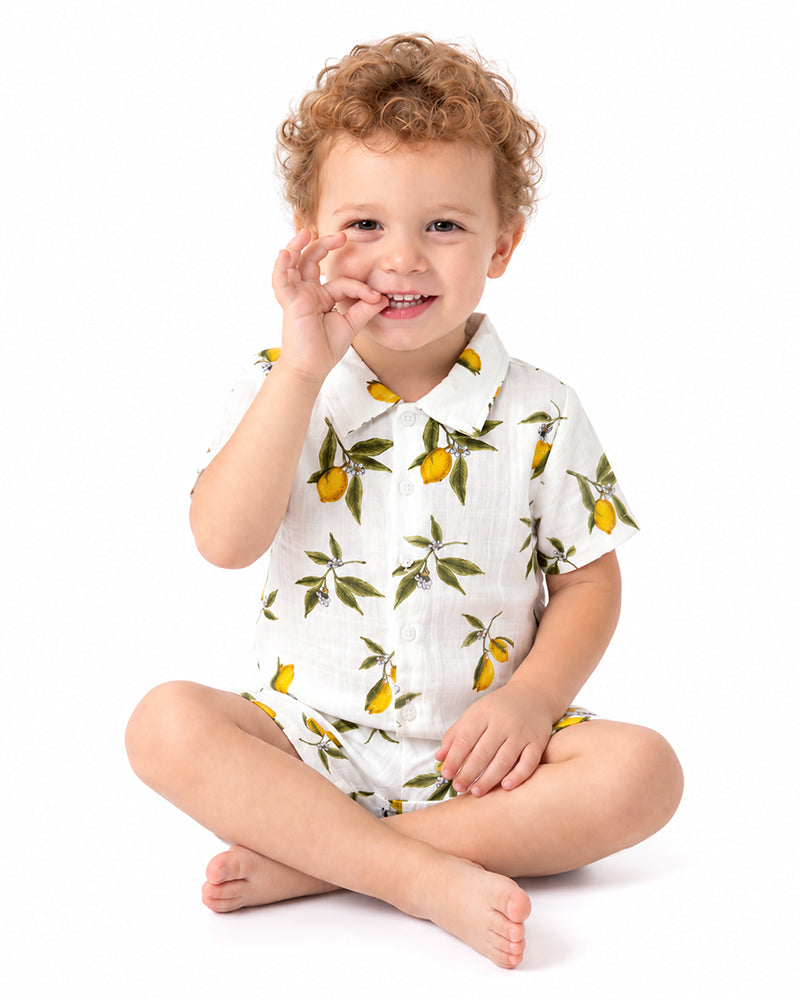Toddler wearing matching citrus print shirt and shorts outfit