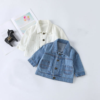 Baby blue denim jacket styled with a white shirt and casual childrenswear accessories